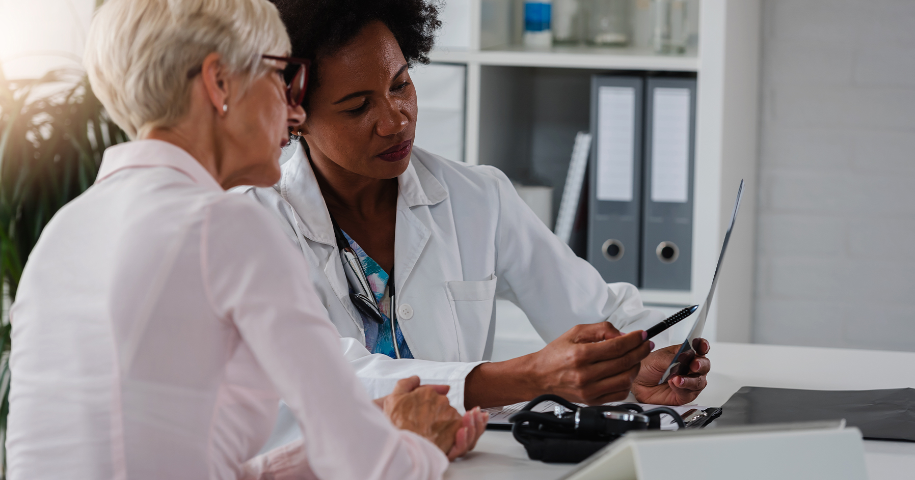 Image of physician discussing menopause treatments with patient.
