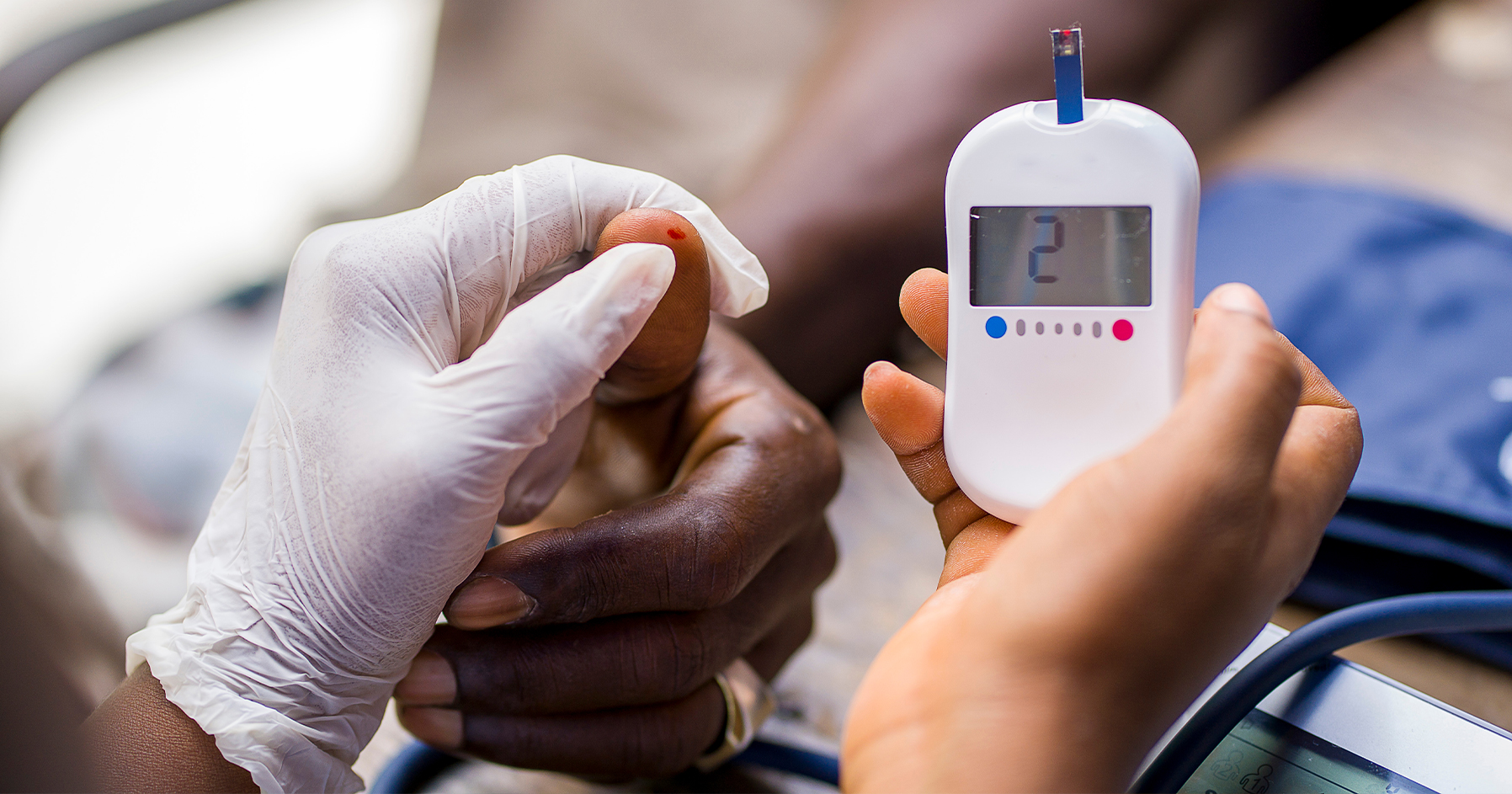 Image of a patient having their blood sugar checked